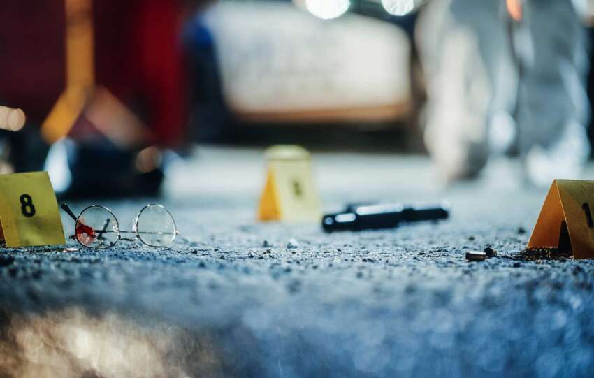 “Crime scene evidence markers on a Cincinnati street, symbolizing the city’s rising violent crime crisis.