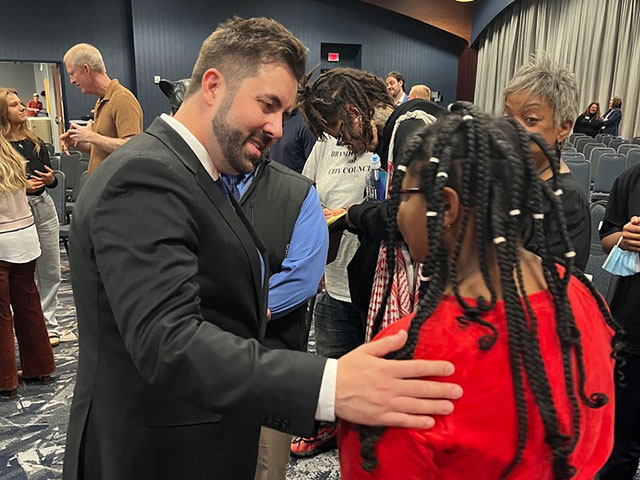 Cory Bowman speaks with supporters after the Cincinnati Mayoral Debate at the Cintas Center.