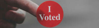 A voter’s finger with an ‘I Voted’ sticker after participating in early voting.