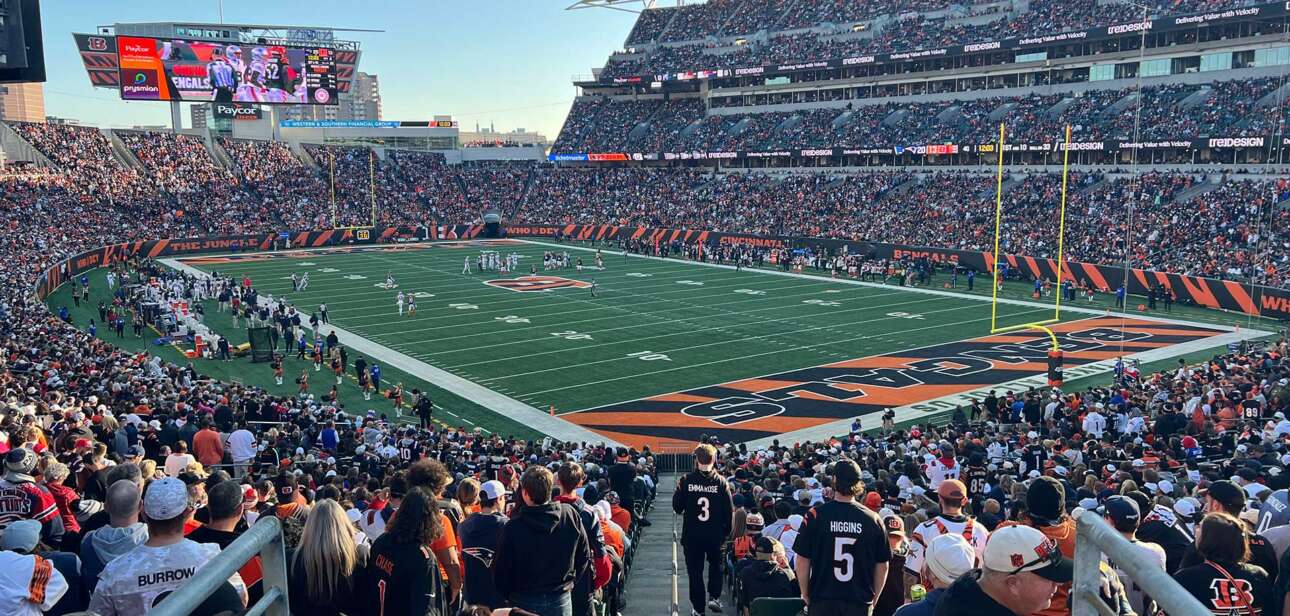 Fans pack Paycor Stadium during the Bengals vs. Patriots game, with the field and stadium atmosphere visible from the stands.