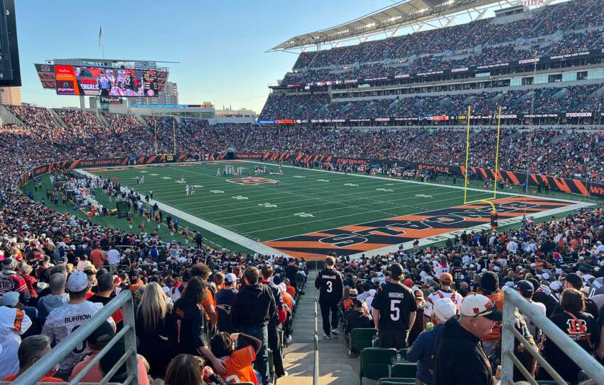 Fans pack Paycor Stadium during the Bengals vs. Patriots game, with the field and stadium atmosphere visible from the stands.