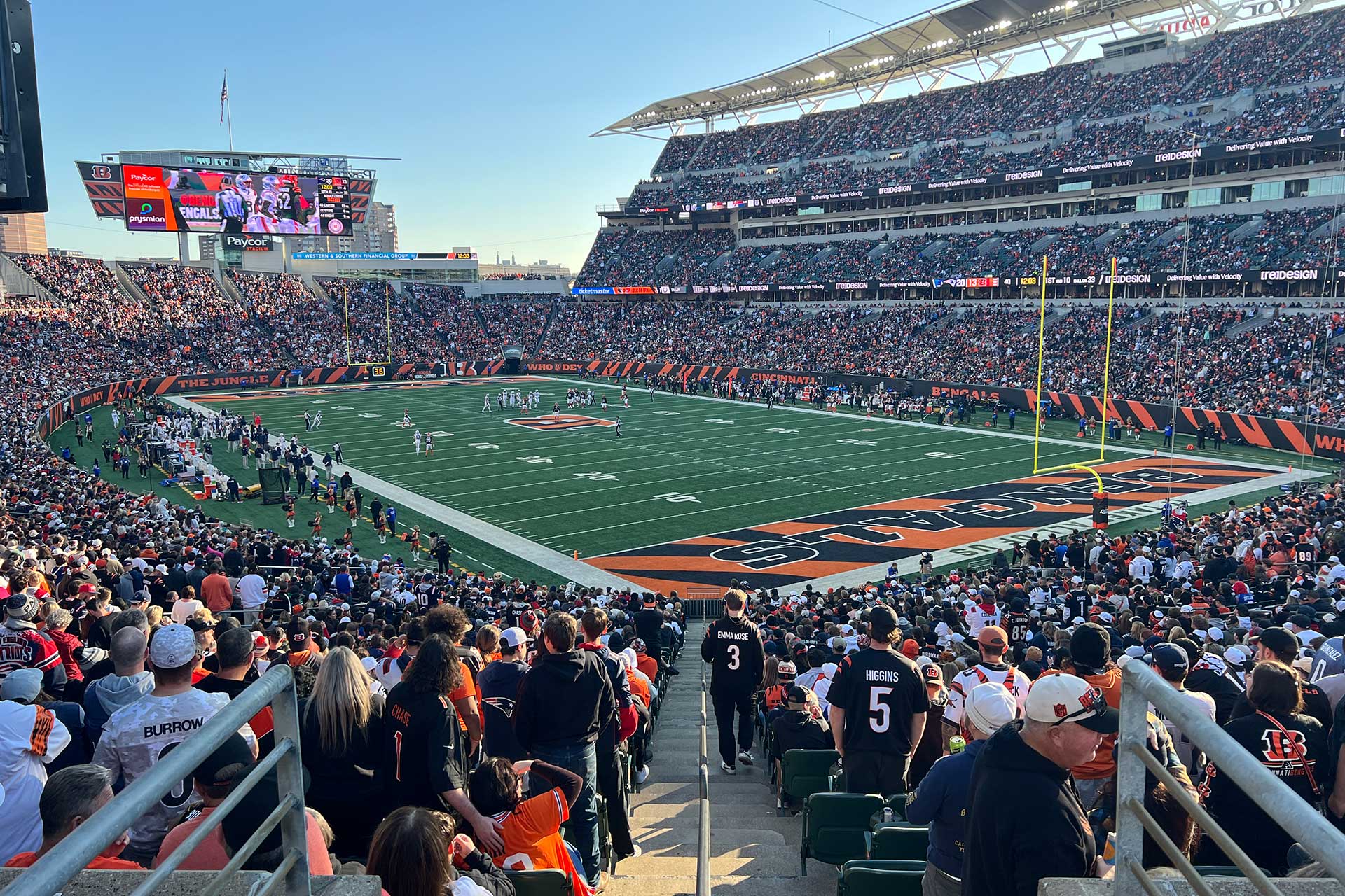 Fans pack Paycor Stadium during the Bengals vs. Patriots game, with the field and stadium atmosphere visible from the stands.