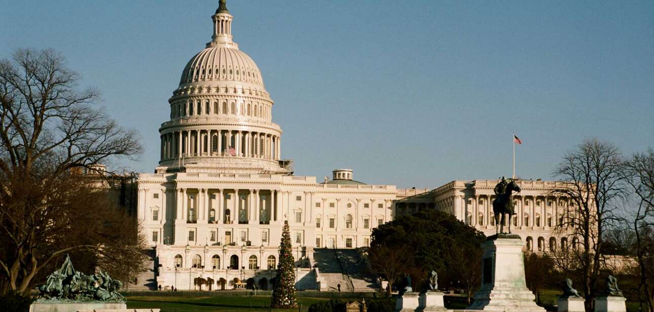 The U.S. Capitol building at sunrise, illustrating Congress’s ongoing government funding crisis.