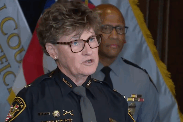 Uniformed police officials speak during a Cincinnati press conference on public safety initiatives.