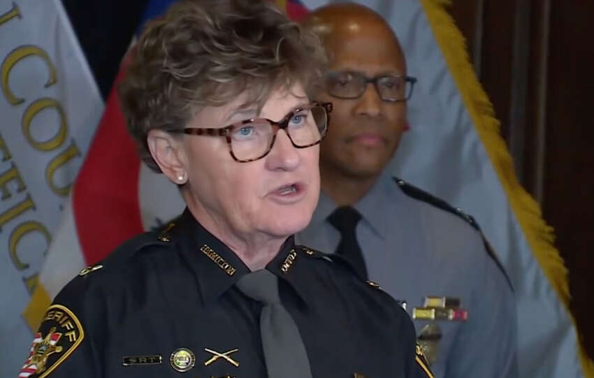 Uniformed police officials speak during a Cincinnati press conference on public safety initiatives.