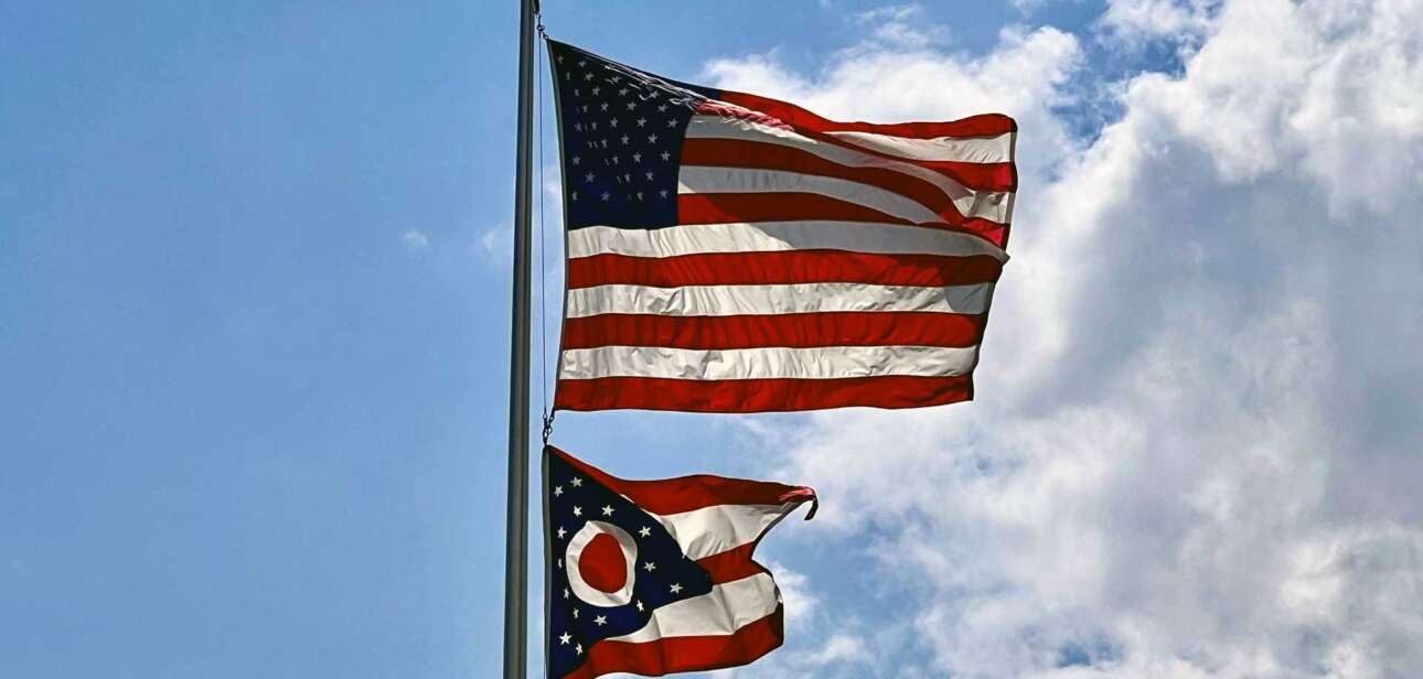Ohio state flag waving in the wind, symbolizing the state’s effort to block foreign election influence.