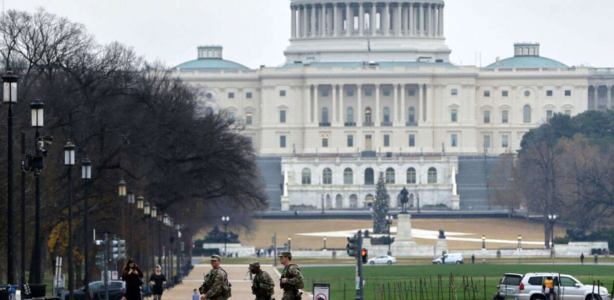 National Guard members patrol near the U.S. Capitol amid investigation into fatal Washington D.C. shooting.