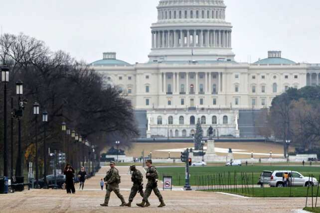 National Guard members patrol near the U.S. Capitol amid investigation into fatal Washington D.C. shooting.