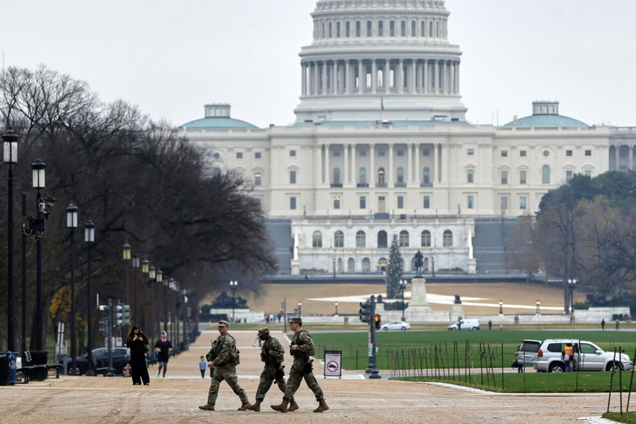 National Guard members patrol near the U.S. Capitol amid investigation into fatal Washington D.C. shooting.