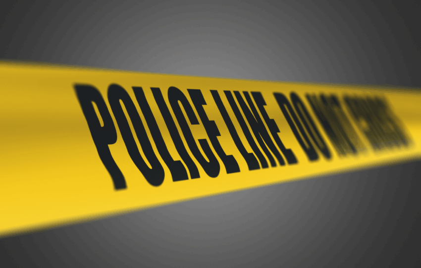 Yellow police tape reading "POLICE LINE DO NOT CROSS" against a dark background, illustrating a crash investigation scene.