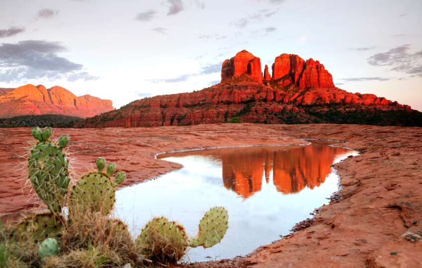 Red rock landscape in Sedona, Arizona with a serene spa retreat in the foreground, perfect for a wellness escape.