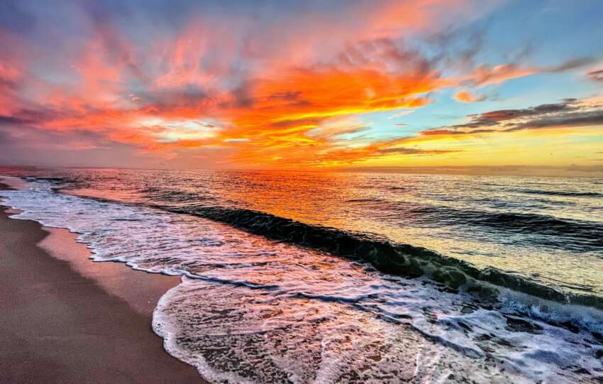 Warm winter sun over a Florida coastline with blue skies and calm water
