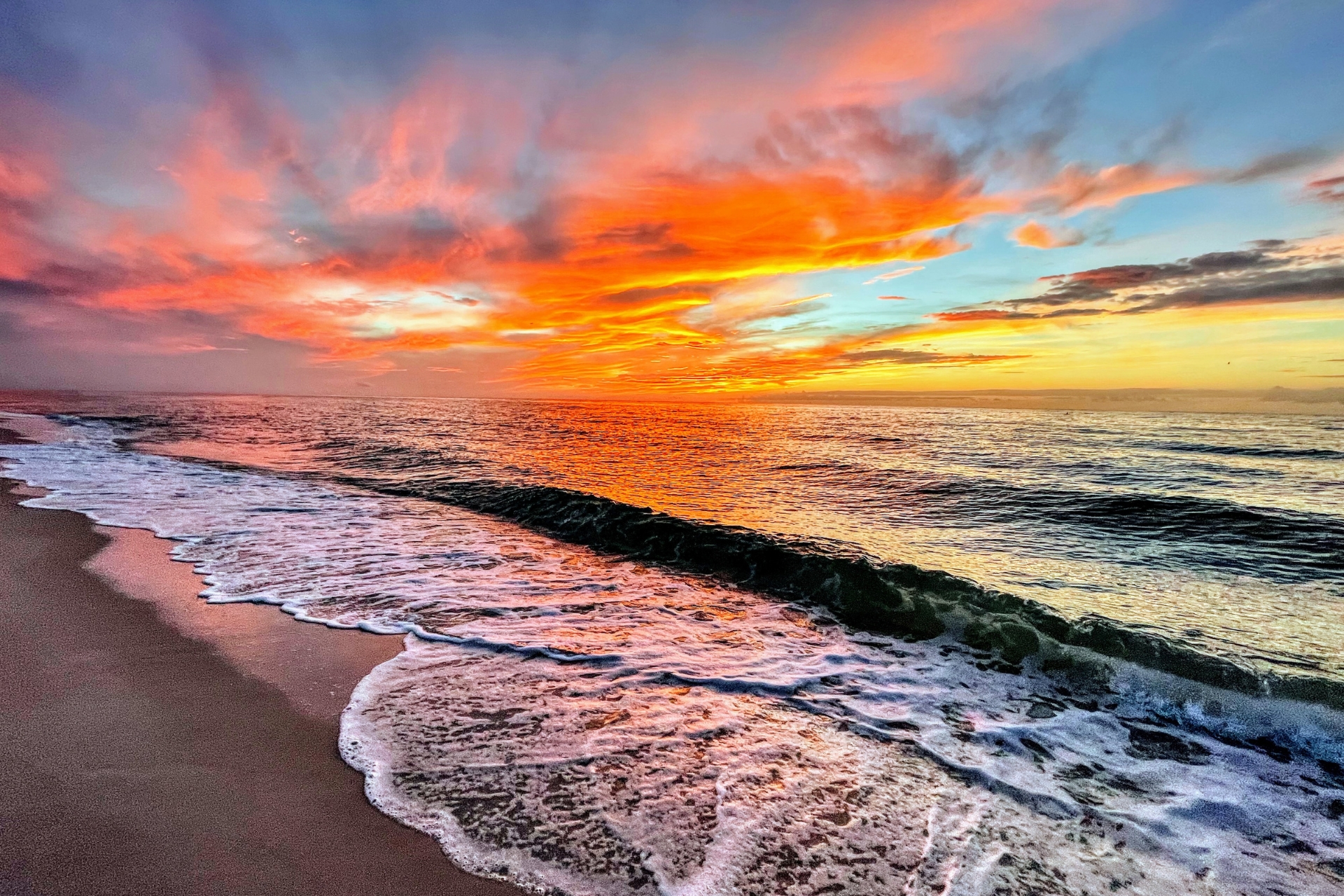 Warm winter sun over a Florida coastline with blue skies and calm water