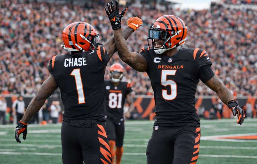 Joe Burrow celebrates with Tee Higgins after a touchdown as the Cincinnati Bengals defeat the Arizona Cardinals in Week 17