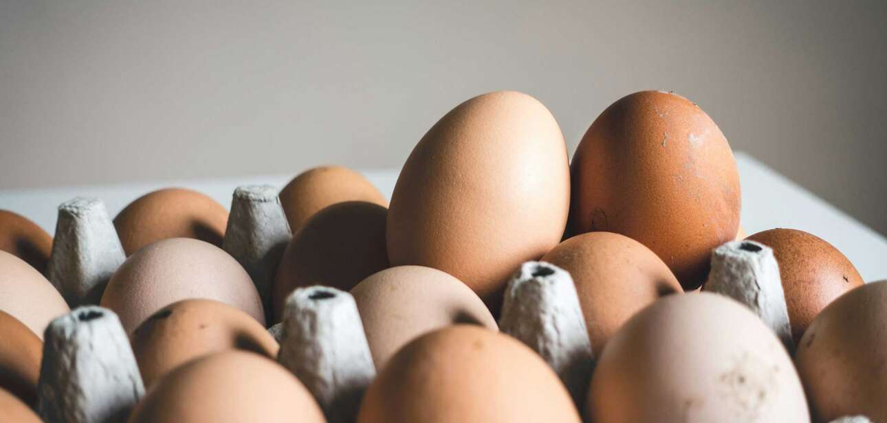 A pile of brown and white eggs used to illustrate common food myths about nutrition.