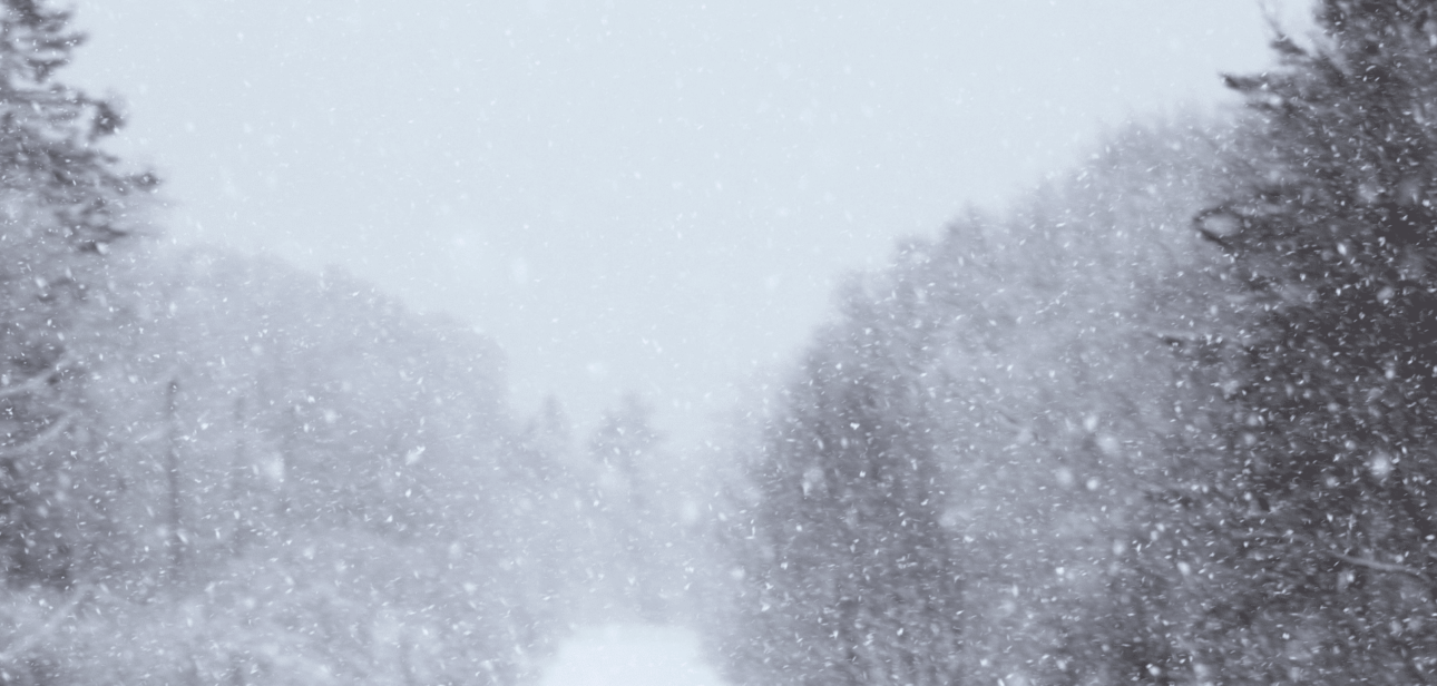 A snow-covered road that represents hazardous driving conditions during the Level 2 snow emergency in Hamilton County, Ohio.