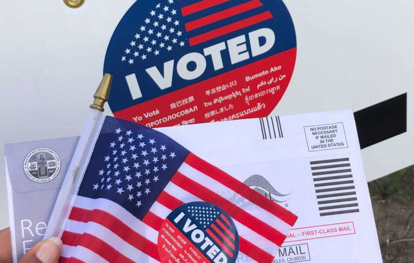 Ohio election integrity concept with absentee ballot, American flag, and “I Voted” sticker