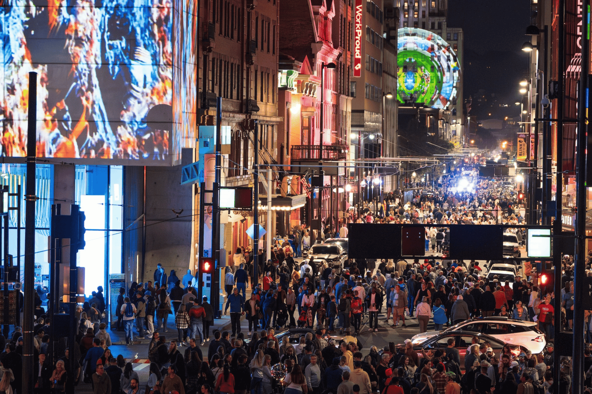 BLINK Cincinnati light festival crowds and ArtsWave public art installation at night.