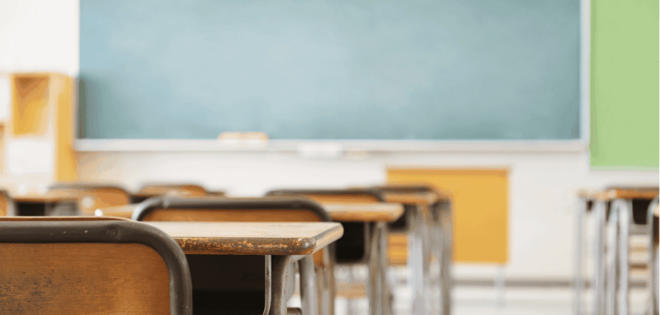 Empty classroom with desks and chalkboard representing Hamilton City Schools funding updates