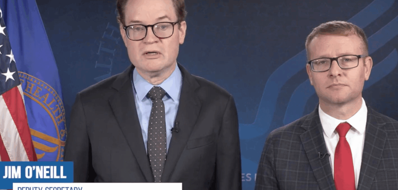 U.S. HHS Deputy Secretary Jim O'Neill on the left and a man in a suit with glasses on the right.