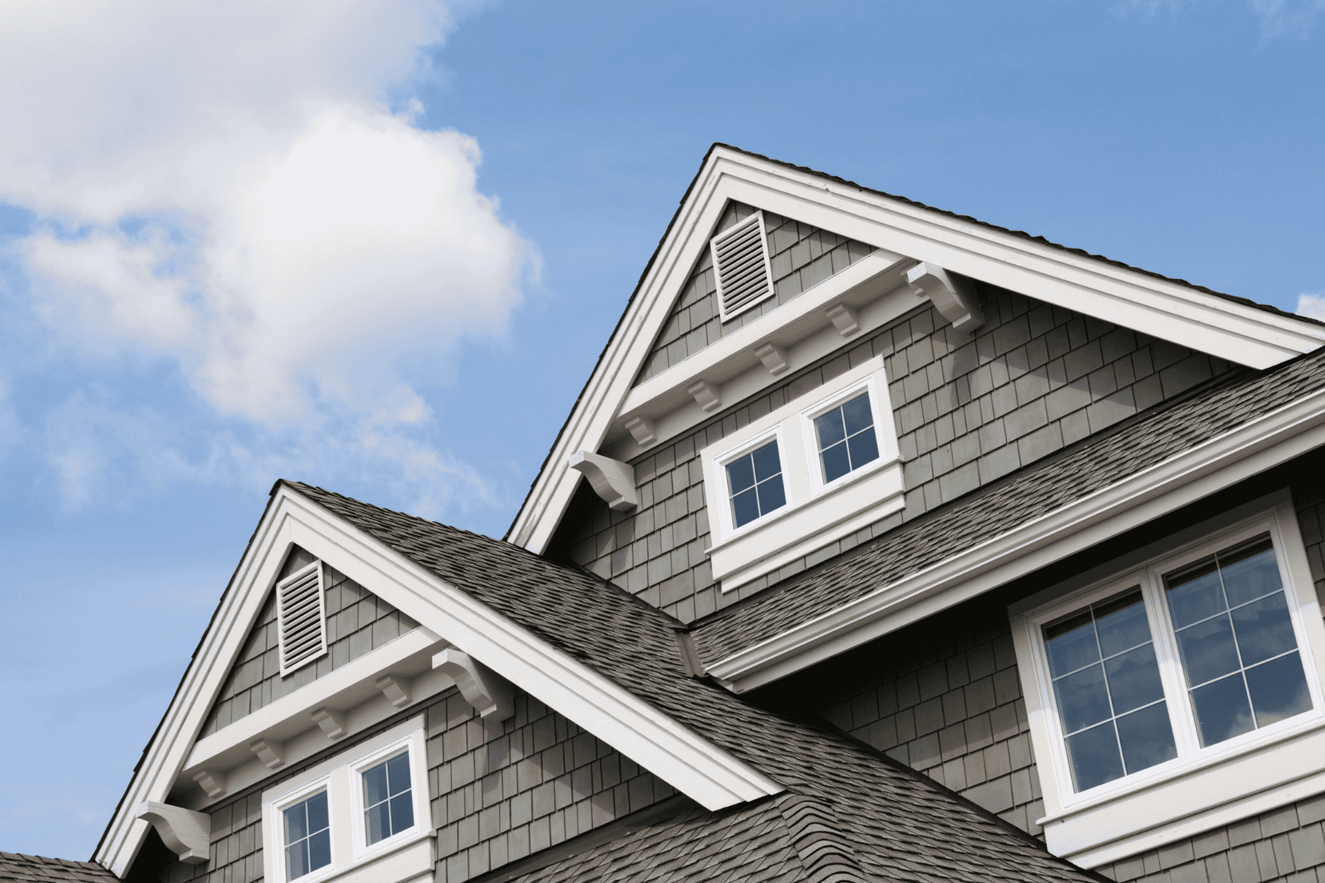 Residential rooftops against a blue sky, illustrating the housing shortage in Kentucky and rising real estate demand.