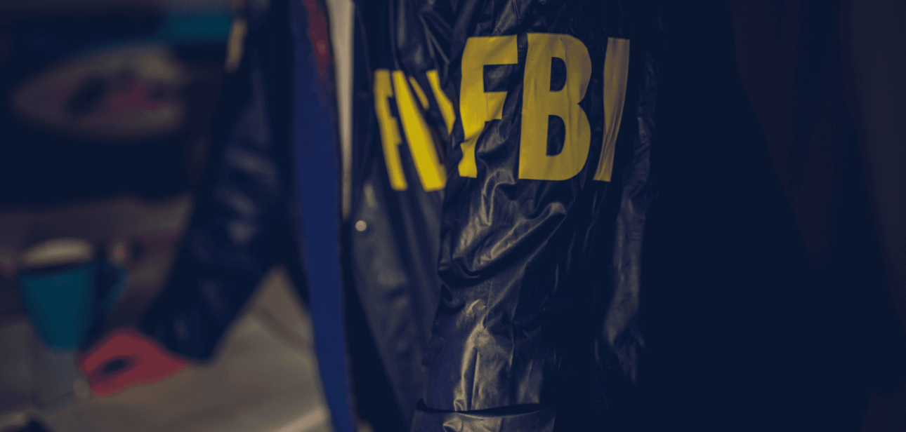 FBI agent jacket representing the dispute over ICE shooting evidence in Minneapolis.