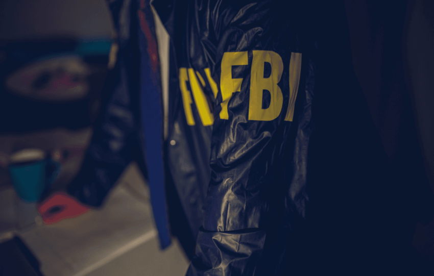 FBI agent jacket representing the dispute over ICE shooting evidence in Minneapolis.