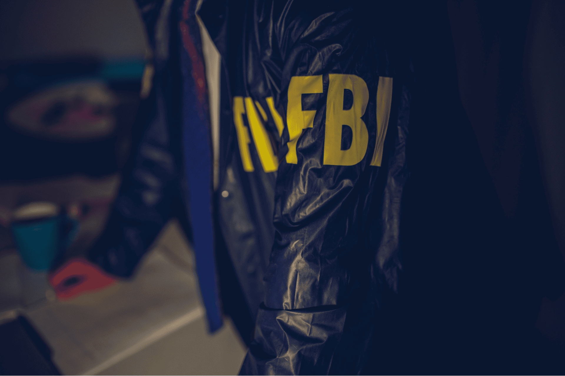 FBI agent jacket representing the dispute over ICE shooting evidence in Minneapolis.