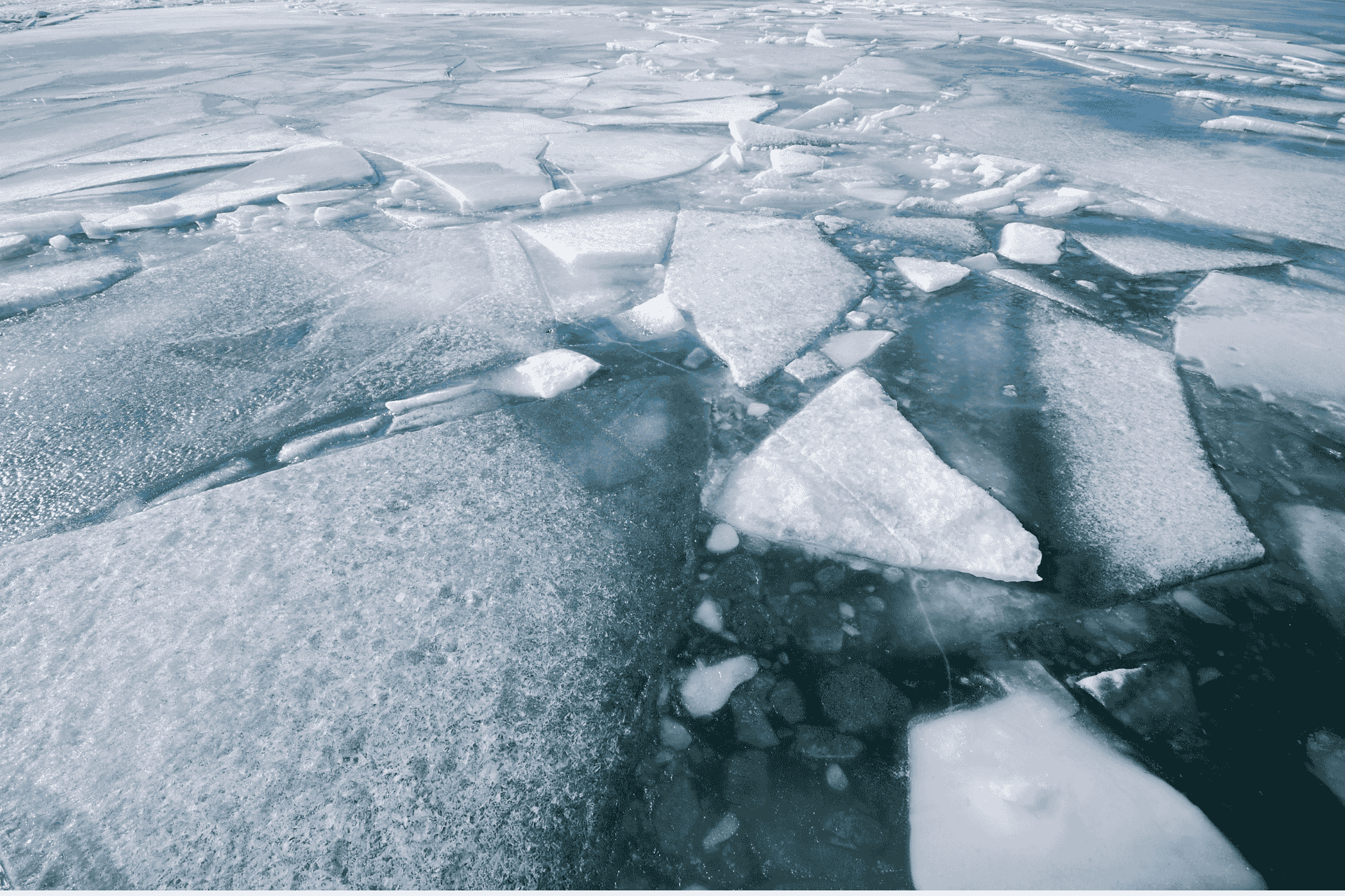 Broken sheets of ice floating on the surface of the frozen Ohio River in Cincinnati.