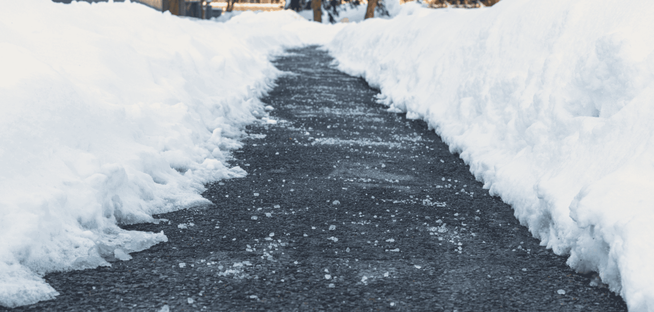 Snow-lined sidewalk cleared after winter storm in Cincinnati