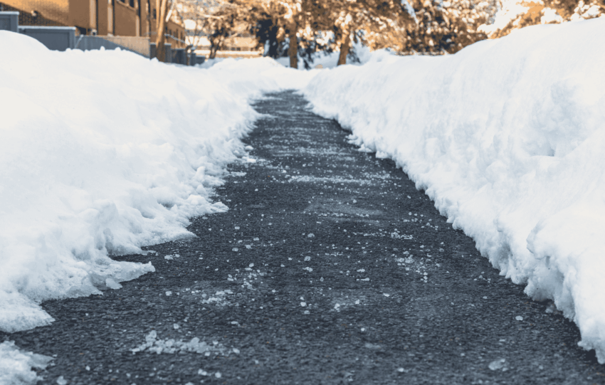 Snow-lined sidewalk cleared after winter storm in Cincinnati
