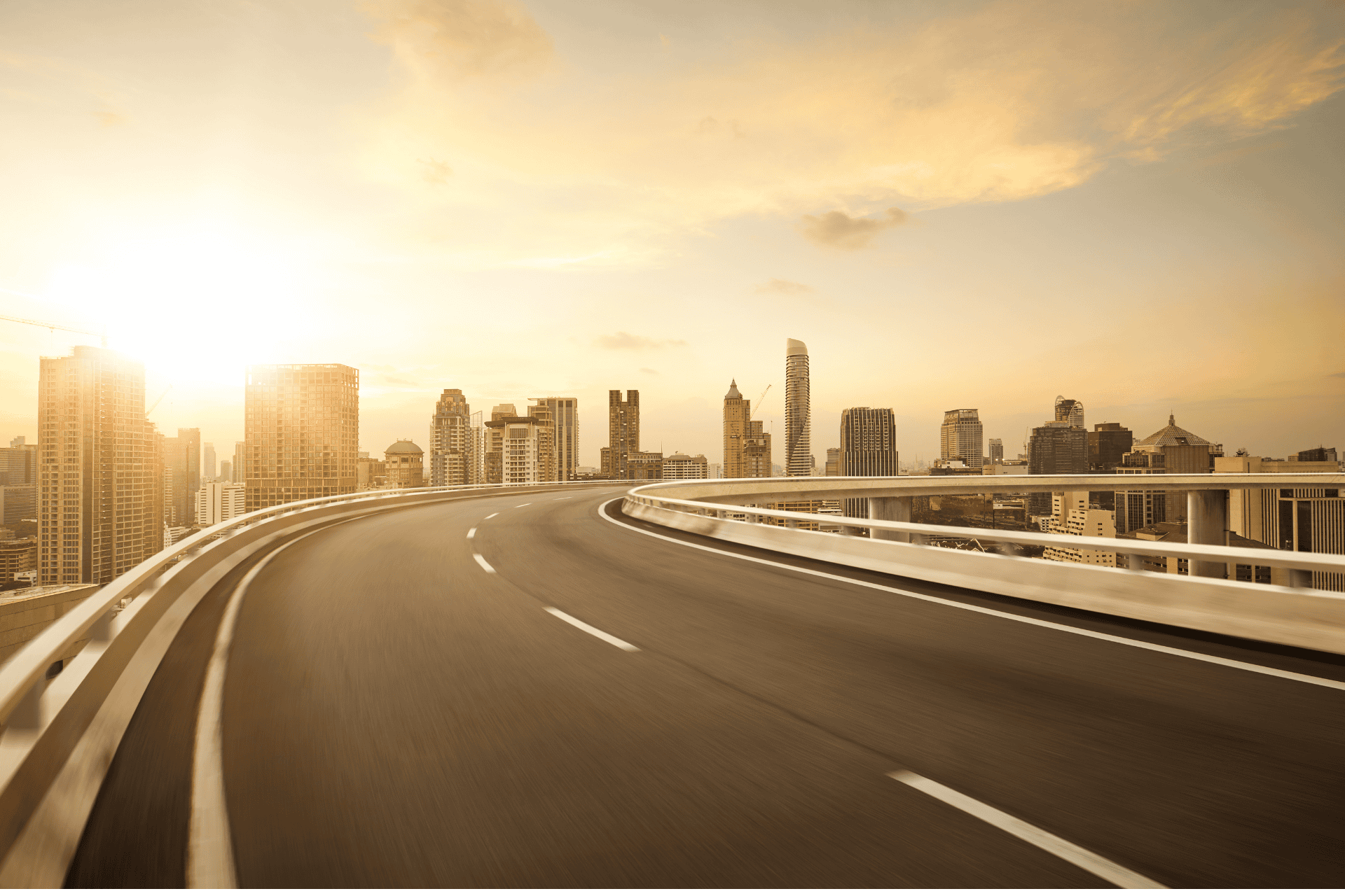 A scenic view of a highway interchange at sunset, representing the I-75 and I-275 improvement project by the Ohio Department of Transportation (ODOT).