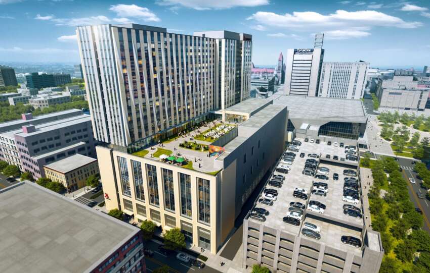 Architectural aerial rendering of the proposed Cincinnati Convention Headquarters Hotel, featuring a tall modern tower and lower terraced sections with green roofs.