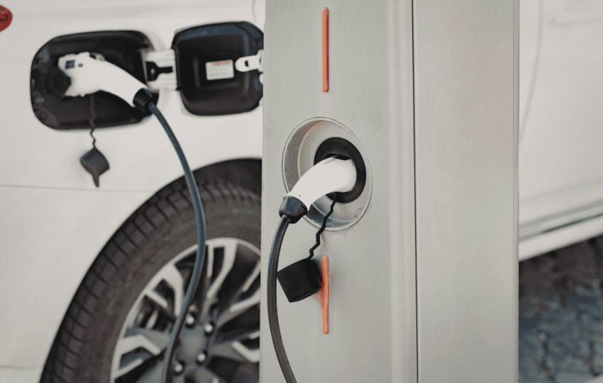 Electric vehicle plugged into a public charging station in Cincinnati, Ohio.