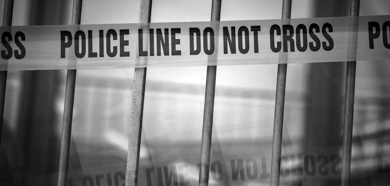 Police line tape outside a downtown Cincinnati scene following weekend shootings in February 2026