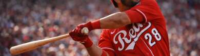 Eugenio Suárez wearing number 28 swings the bat for the Cincinnati Reds during a game at Great American Ball Park.
