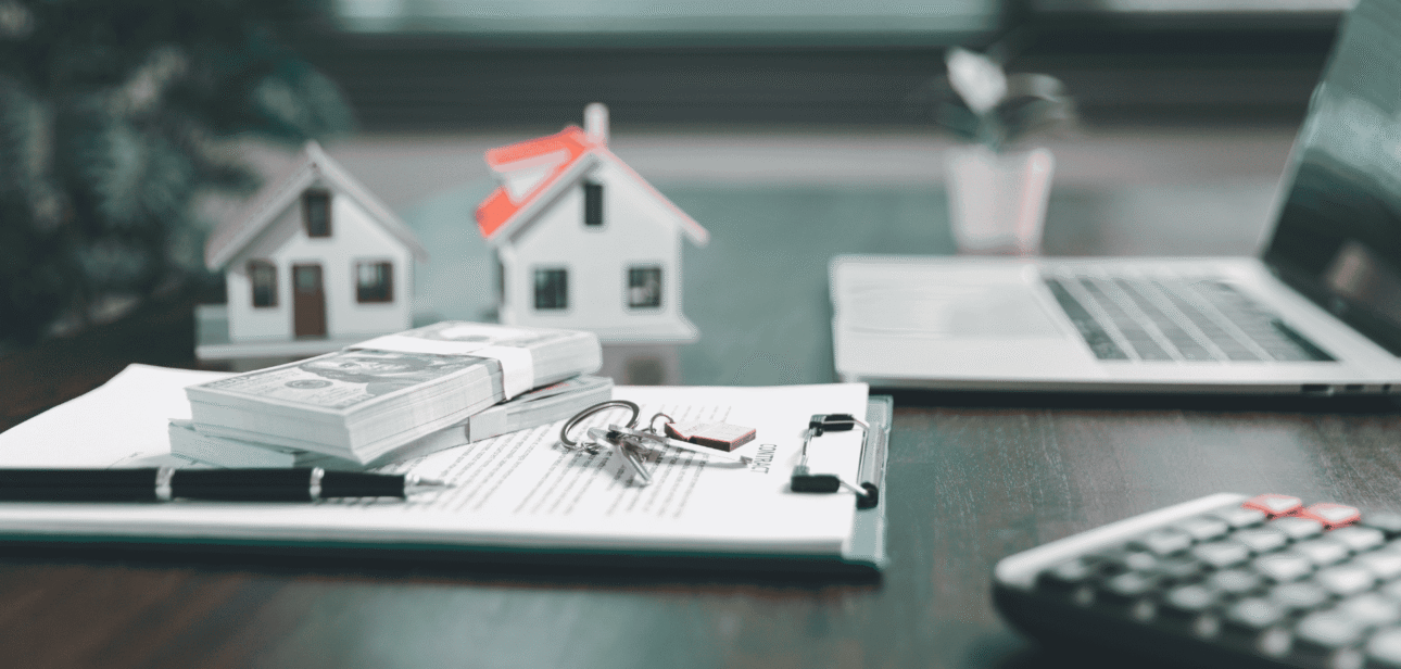 Model house, calculator, and documents representing Ohio property taxes