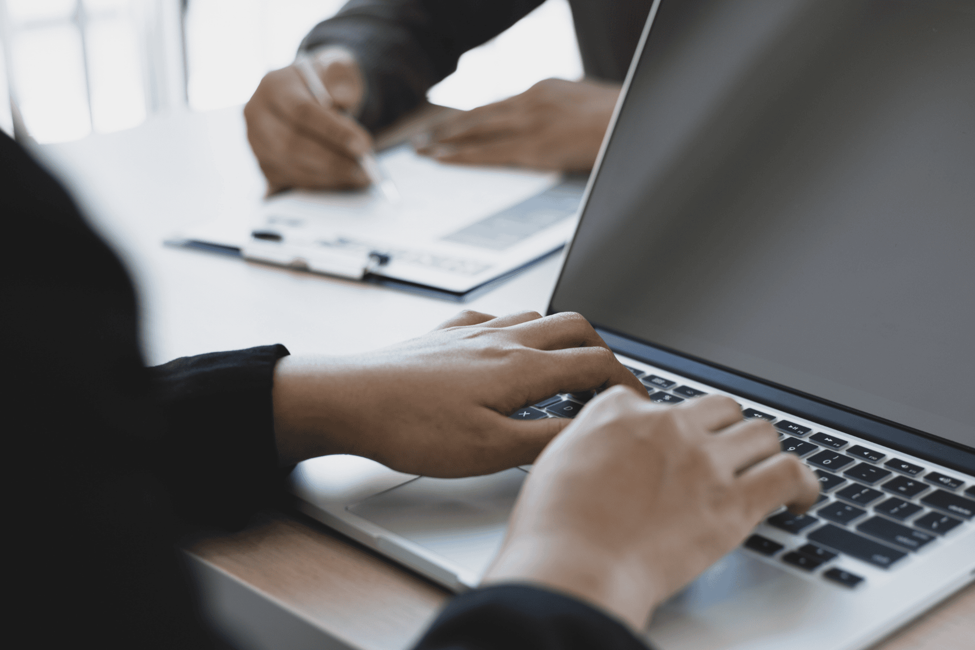 Close-up of hands typing on a laptop, illustrating the Ohio tech boom and startup funding growth.