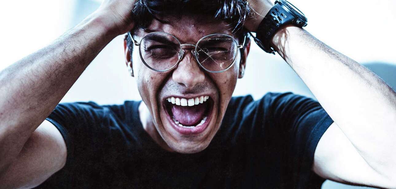 Man expressing visible frustration, illustrating rising political hostility and social tension