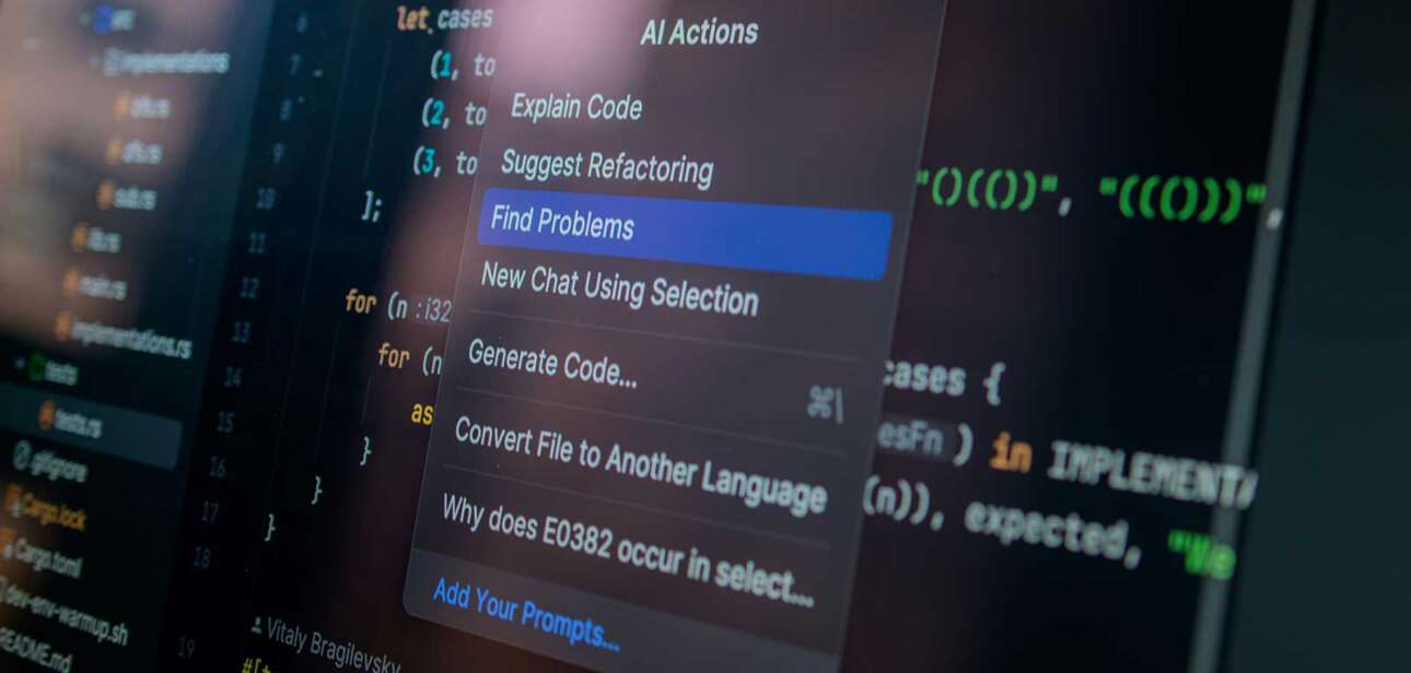 AI-generated code displayed on a computer screen representing the shift toward outcome specification in modern knowledge work.