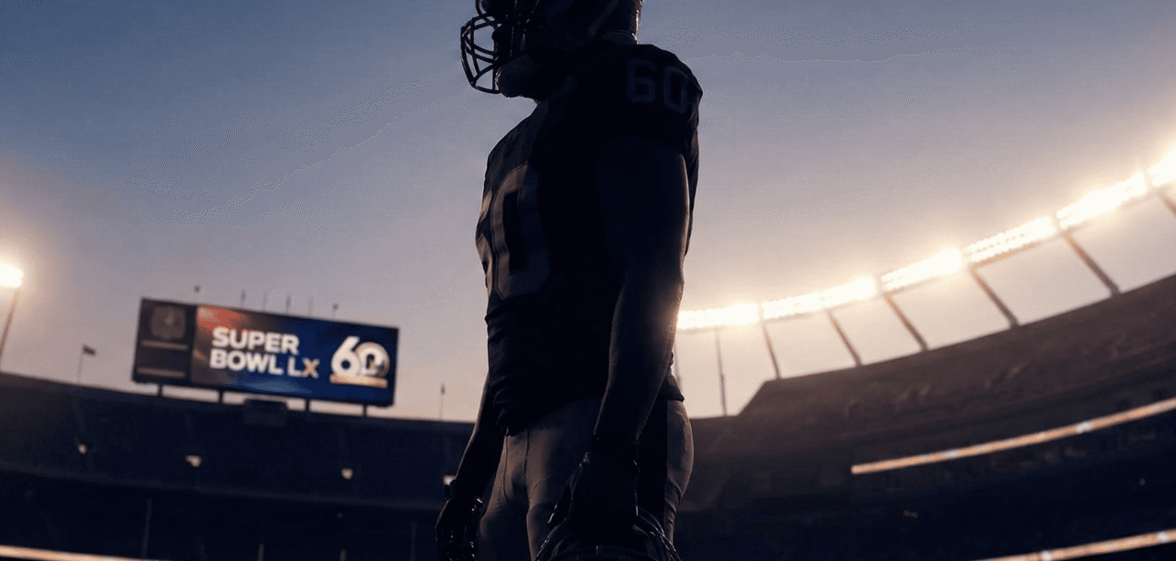 Silhouette of a football player standing in a dimly lit stadium under bright floodlights, representing the Super Bowl LX halftime show.