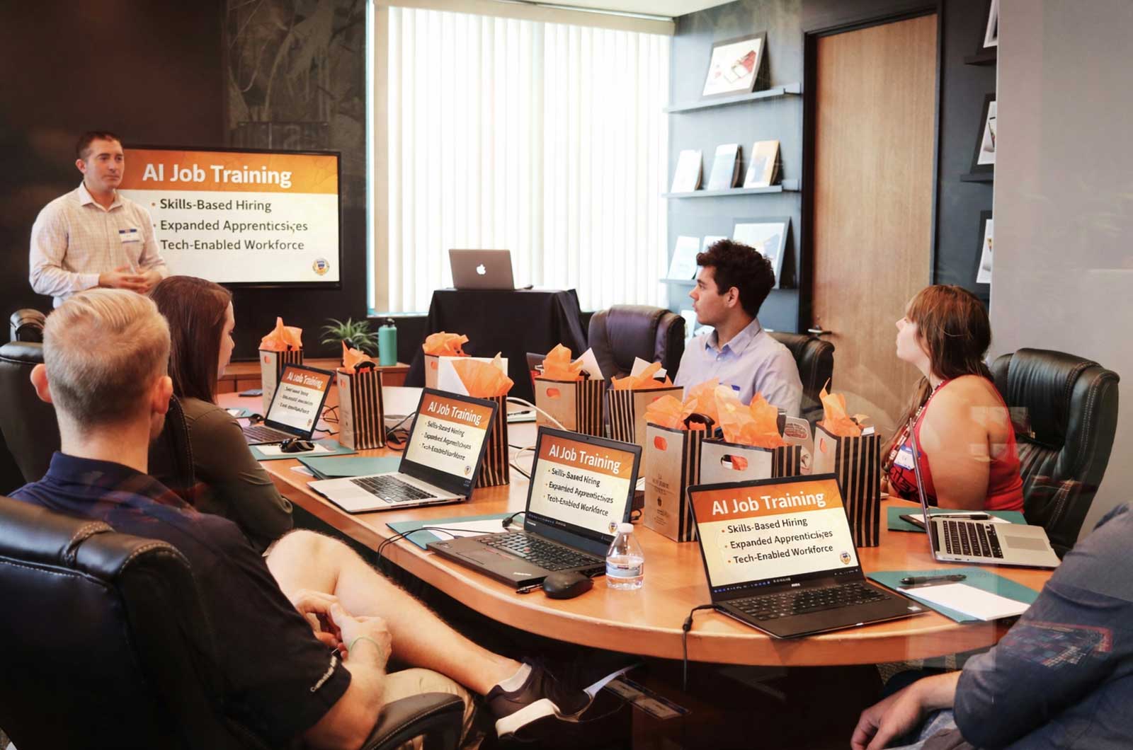 AI job training in Cincinnati with professionals learning skills during a team workshop