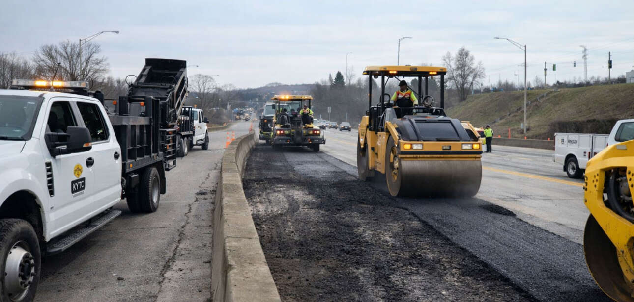 Road crews repave damaged lanes on Interstate 471 in Newport Kentucky after a gasoline tanker explosion burned sections of the roadway