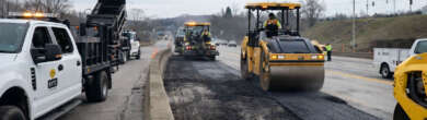 Road crews repave damaged lanes on Interstate 471 in Newport Kentucky after a gasoline tanker explosion burned sections of the roadway