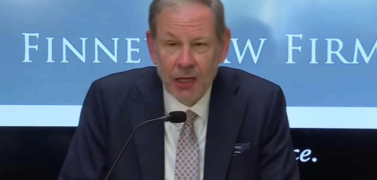 Attorney Stephen Imm speaking at a microphone during a press conference at Finney Law Firm regarding the legal challenge to the firing of Cincinnati Police Chief Teresa Theetge.