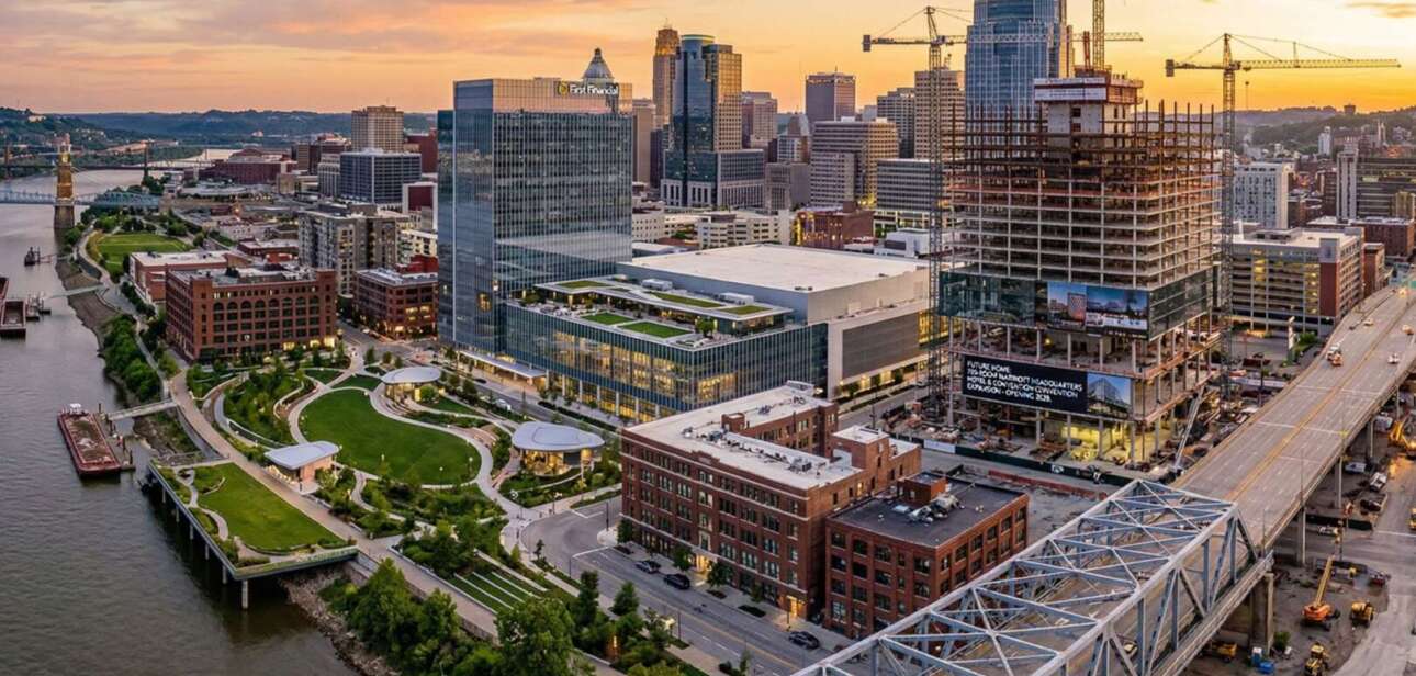 Aerial view of the downtown Cincinnati skyline and Ohio Riverfront featuring ongoing urban development projects and construction.