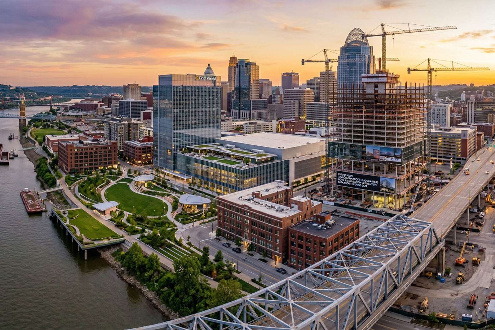 Aerial view of the downtown Cincinnati skyline and Ohio Riverfront featuring ongoing urban development projects and construction.