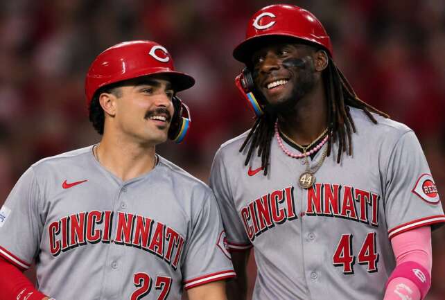 Elly De La Cruz and Sal Stewart celebrating during Reds hot start in 2026