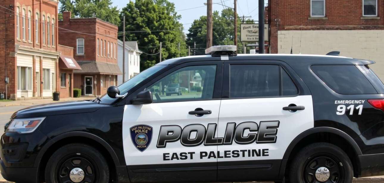 An East Palestine, Ohio police SUV parked on a town street, illustrating the ongoing debate over police recruitment age proposals in the state.