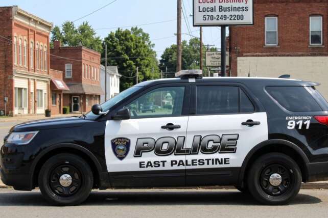 An East Palestine, Ohio police SUV parked on a town street, illustrating the ongoing debate over police recruitment age proposals in the state.